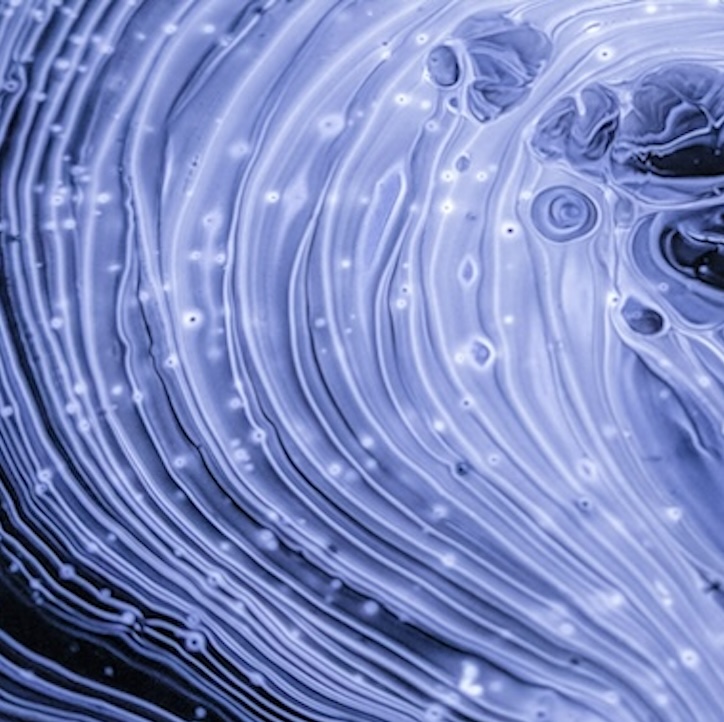 An abstract rendering of what looks like wavy lines of paint, extending in nesting circles; it evokes electricity and energy.