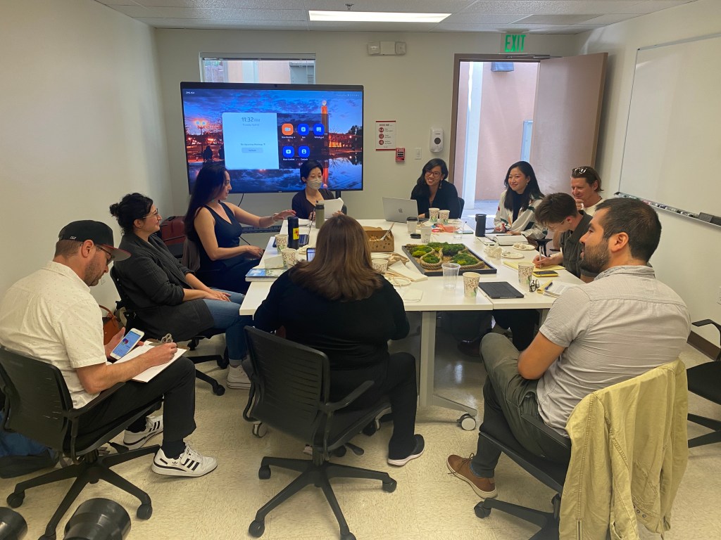 A group of people sitting at a table.